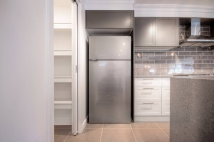 Overhead cabinet and blade wall to fridge space